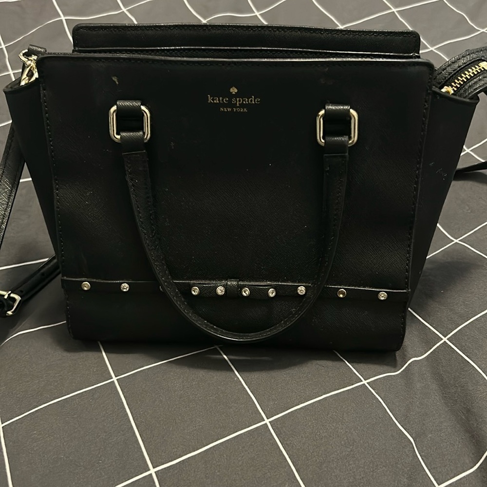 Lightly used black Kate Spade crossbody tote bag. Super cute and fashionable!